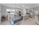 Open kitchen with an island, stainless steel appliances, and a dining area at 1020 Taproot Dr, Winter Springs, FL 32708