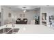 Open-concept living room, seamlessly integrated into the kitchen area with neutral toned modern decor at 1020 Taproot Dr, Winter Springs, FL 32708