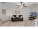 Comfortable living room with a leather sofa, accent chairs, and plenty of natural light at 1020 Taproot Dr, Winter Springs, FL 32708