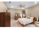 Spacious main bedroom featuring a ceiling fan, dresser, and natural light at 1020 Taproot Dr, Winter Springs, FL 32708