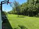 Expansive backyard with trees and a basketball hoop at 11187 Savannah Landing Cir, Orlando, FL 32832
