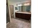 Bathroom featuring a double vanity, tile flooring and walk in shower at 11187 Savannah Landing Cir, Orlando, FL 32832