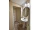Small bathroom with a sink, mirror, shelving and tile floors at 11187 Savannah Landing Cir, Orlando, FL 32832