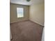 Carpeted bedroom with natural light from window at 11187 Savannah Landing Cir, Orlando, FL 32832