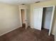 Bedroom features a closet and neutral colored walls and carpeting at 11187 Savannah Landing Cir, Orlando, FL 32832