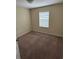 Bedroom featuring a window and neutral walls and carpet at 11187 Savannah Landing Cir, Orlando, FL 32832