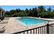 Community pool with a wading area, surrounded by paved decking and lounge chairs for relaxation at 11187 Savannah Landing Cir, Orlando, FL 32832