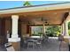 Community covered patio featuring ceiling fans, tables, chairs, and a barbecue area for outdoor gatherings at 11187 Savannah Landing Cir, Orlando, FL 32832