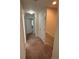 Carpeted hallway features neutral colored walls and white doors at 11187 Savannah Landing Cir, Orlando, FL 32832