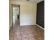 View of spacious living room featuring neutral walls and floors, and a glimpse of the kitchen at 11187 Savannah Landing Cir, Orlando, FL 32832