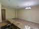 Bright, open living space adjacent to the kitchen, showcasing tile floors and a modern aesthetic at 11187 Savannah Landing Cir, Orlando, FL 32832