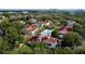 This aerial view shows a resort-style community with a pool, tennis courts, and well-maintained landscaping at 11568 Westwood Blvd # 1015, Orlando, FL 32821