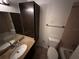 Cozy bathroom featuring a vanity with sink, mirror, and a toilet with bathtub at 11568 Westwood Blvd # 1015, Orlando, FL 32821