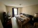 Bedroom with a queen sized bed and view of dresser and lamp at 11568 Westwood Blvd # 1015, Orlando, FL 32821