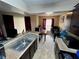 Open kitchen with a sink and view of the dining and living area at 11568 Westwood Blvd # 1015, Orlando, FL 32821