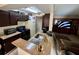 Kitchen view with appliances, counter space, and a view to the living area at 11568 Westwood Blvd # 1015, Orlando, FL 32821