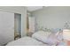 Comfortable bedroom with twin beds, closet storage, and a calming color palette at 1219 Normandy Dr, Haines City, FL 33844