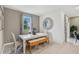 Well-lit dining area with a modern table, bench seating, and decorative accents at 1219 Normandy Dr, Haines City, FL 33844