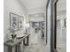 Inviting entryway with modern decor, leading to an open-concept living space and kitchen at 1219 Normandy Dr, Haines City, FL 33844