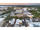 Scenic aerial view of a commercial district with beautiful trees and distant views of lakes and cityscape at sunset at 140 E Morse Blvd # J, Winter Park, FL 32789