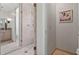 Modern bathroom showcasing a glass-enclosed shower with sleek fixtures and neutral tiling at 140 E Morse Blvd # J, Winter Park, FL 32789
