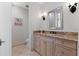 Well-appointed bathroom with marble countertops, decorative sconces, and a separate toilet area at 140 E Morse Blvd # J, Winter Park, FL 32789