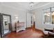 Bright bedroom with hardwood floors, large window, and stylish furnishings at 140 E Morse Blvd # J, Winter Park, FL 32789