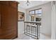 Charming breakfast nook with a table, two stools, a window, and a decorative painting for a cozy dining space at 140 E Morse Blvd # J, Winter Park, FL 32789