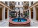 Intimate courtyard area with fountain, outdoor dining and lounge areas at 140 E Morse Blvd # J, Winter Park, FL 32789