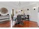 Dining room featuring hardwood floors, a round wooden table, and stylish furniture, perfect for entertaining at 140 E Morse Blvd # J, Winter Park, FL 32789