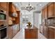 Well-equipped kitchen featuring granite countertops, stainless steel appliances, and wood cabinetry at 140 E Morse Blvd # J, Winter Park, FL 32789