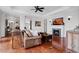 Comfortable living room with hardwood floors, fireplace, and neutral paint, creating a warm atmosphere at 140 E Morse Blvd # J, Winter Park, FL 32789