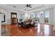 Bright living room with gleaming hardwood floors, a decorative fireplace, and French doors to the balcony at 140 E Morse Blvd # J, Winter Park, FL 32789