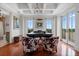 Spacious office with coffered ceilings, french doors to balcony, and stylish decor at 140 E Morse Blvd # J, Winter Park, FL 32789