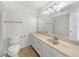 Bright bathroom with a large mirror, modern vanity, and tile flooring at 1404 Oak Pl # A, Apopka, FL 32712
