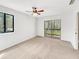 Bright bedroom with neutral carpet and sliding door leading to screened in porch at 1404 Oak Pl # A, Apopka, FL 32712