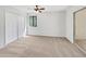 Simple bedroom featuring neutral carpet, natural light, and large closet at 1404 Oak Pl # A, Apopka, FL 32712