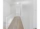 Upstairs hallway featuring neutral carpet, white walls, and white banister at 1404 Oak Pl # A, Apopka, FL 32712