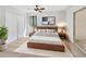 Cozy bedroom features a ceiling fan, natural light, and large closet at 1404 Oak Pl # A, Apopka, FL 32712