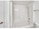 All-white shower and tub combination with brushed nickel fixtures at 1404 Oak Pl # A, Apopka, FL 32712