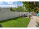 Private fenced backyard featuring a beautiful lawn and cozy fire pit area with pavers at 1770 Chinook Trl, Maitland, FL 32751