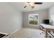 Bedroom features a ceiling fan, and a window for natural light at 1770 Chinook Trl, Maitland, FL 32751