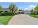 Well-maintained one-story home with mature landscaping, concrete driveway, and an attached garage at 1770 Chinook Trl, Maitland, FL 32751