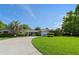 Charming single-story home with lush lawn and a circular driveway, showcasing curb appeal at 1770 Chinook Trl, Maitland, FL 32751