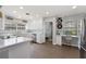 Bright kitchen with white cabinetry, stainless steel appliances, and a built-in wine rack at 1770 Chinook Trl, Maitland, FL 32751