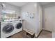 Functional laundry room featuring modern appliances, storage, and stylish design at 1770 Chinook Trl, Maitland, FL 32751