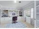 Well-lit home office with custom built-ins, crown molding, and a tranquil view of the outdoors at 1770 Chinook Trl, Maitland, FL 32751