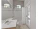 Bathroom featuring a tiled shower and bath, updated fixtures, and a neutral color palette at 1907 Sir Lancelot Cir, St Cloud, FL 34772