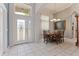 The foyer features tile flooring, a decorative front door, and a dining area at 1907 Sir Lancelot Cir, St Cloud, FL 34772