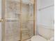 Bathroom with tiled shower, glass door, and updated fixtures at 2003 Bentwood Dr, Winter Park, FL 32792